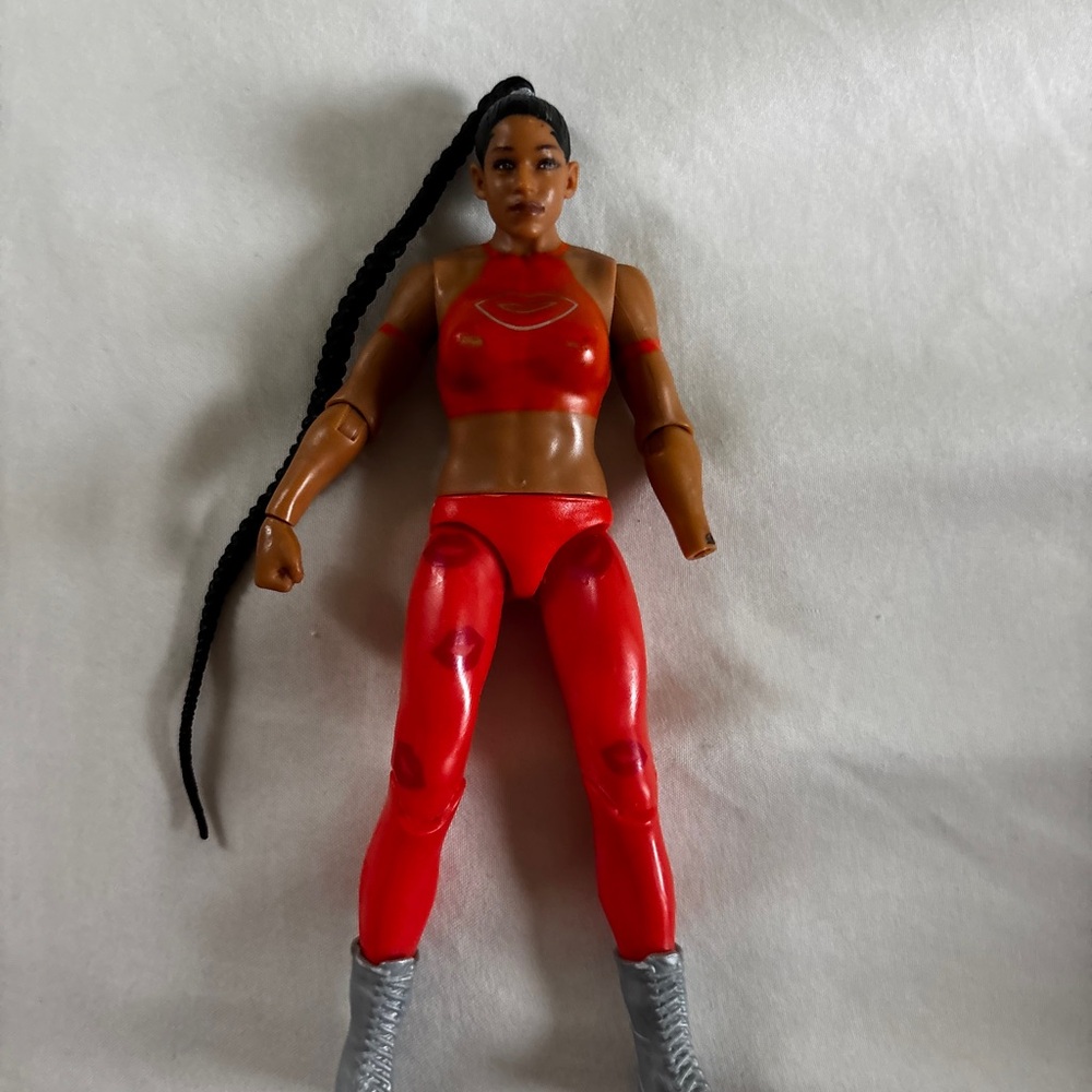 Red Action Figure with Long Braid